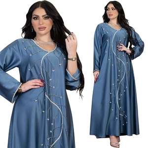Detail of silver rhinestone branch embroidery on grey-blue satin abaya dress