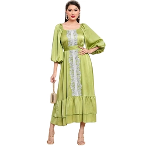Elegant green satin kaftan dress with silver embroidery, puff sleeves and a waist tie