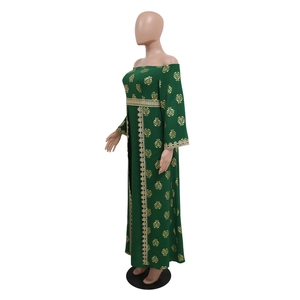 Side view of dark green off-shoulder dress with golden floral prints and lace details