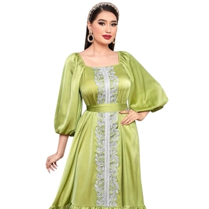 Light green kaftan dress with puff sleeves and silver lace embroidery details