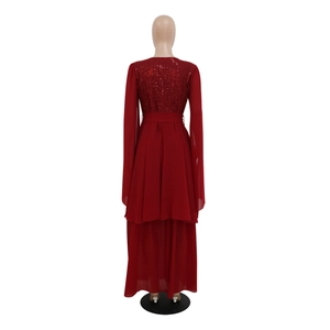 Back view of red sequin evening dress with chiffon skirt and long sleeves