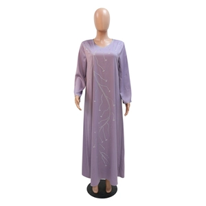 Detail of purple loose abaya dress showing silver rhinestone branch pattern on neckline