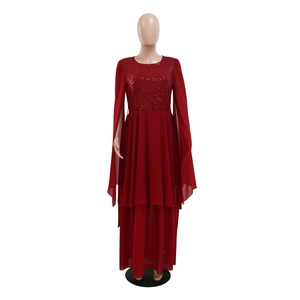 Close-up of sequined bodice and burgundy chiffon cape sleeves on evening gown