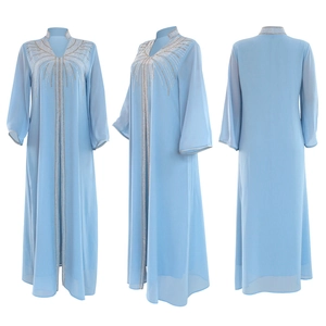 Detailed views of light blue kaftan dress with silver sequin radial patterns and waist belt