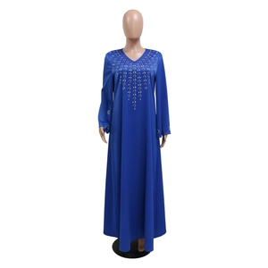 Detailed embroidery with gold sequins on the V-neck of a blue loose kaftan dress