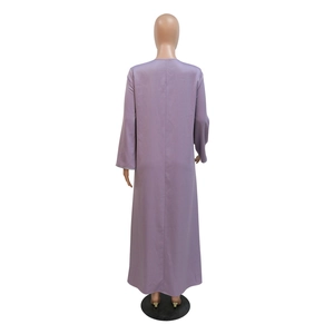 Back view of a modest lavender long-sleeve maxi dress with shimmering fabric and beaded cuffs