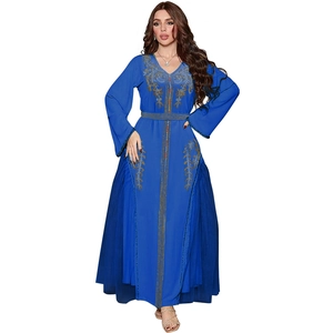 Close-up of royal blue mesh dress with gold embroidery and beadwork details