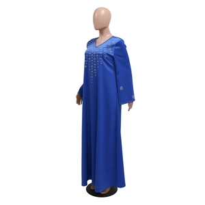 Detailed view of rhinestone leaf patterns on the V-neckline of a navy blue kaftan robe