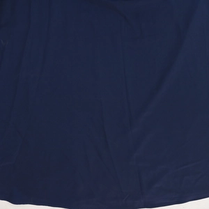 Detailed view of sequin embroidered hem on navy blue loose casual V-neck maxi dress