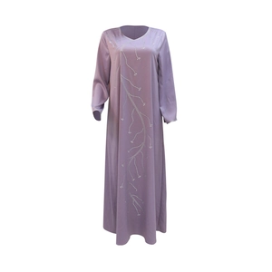 Close-up detail of silver rhinestone vine patterns on a lavender Middle Eastern abaya robe