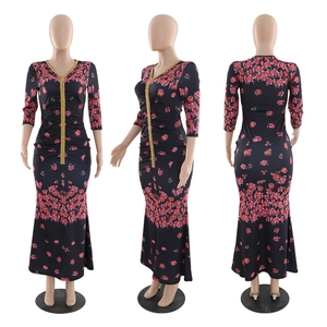 Detail of floral kaftan dress with golden sequin trim and ruched slimming waist design