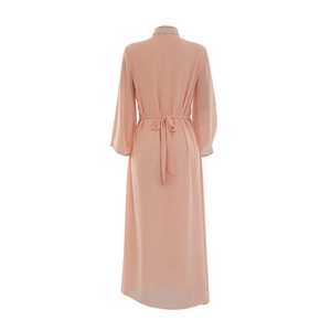 Detail of light peach chiffon kaftan back with an elegant waist tie bow and sequins