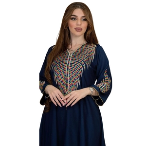 Detail of colorful ethnic embroidery on dark blue long sleeve v-neck abaya maxi dress