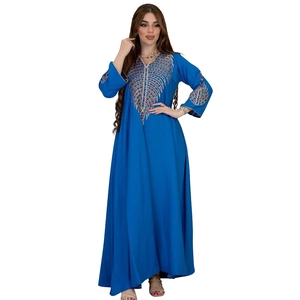 Exquisite embroidery detail on the bodice and sleeves of the navy blue maxi dress