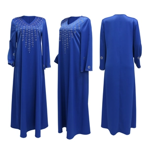 Detail of royal blue V-neck abaya dress with rhinestone leaf patterns and flare sleeves