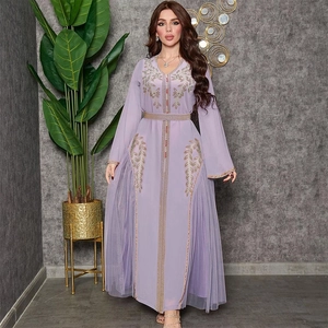 Detail of lavender mesh kaftan dress with intricate gold embroidery and sequin floral patterns