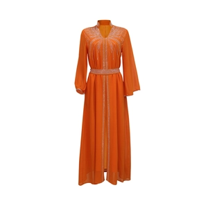 Detail of orange chiffon kaftan dress featuring rhinestone patterns and beaded waist belt
