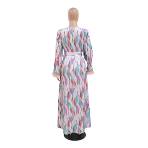 Detail of long sleeve printed maxi dress with sequin fringes and wave pattern