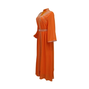 Detail of orange chiffon kaftan dress featuring luxury rhinestone neckline and belted waist