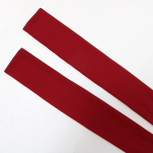 Detail of red sequin evening dress matching belt accessory in premium knit fabric