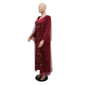 Detail of the elegant burgundy evening gown featuring sparkling rhinestone branch patterns