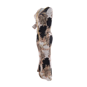 Detail of V-neckline with golden sequin trim on leopard baroque print kaftan dress