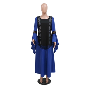 Detail of royal blue kaftan dress with bell sleeves and black lace patchwork design