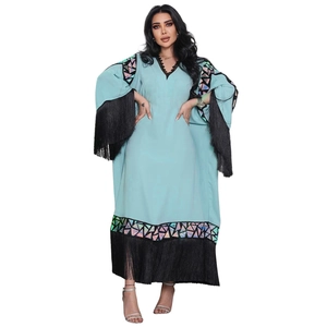 Light blue abaya dress featuring wide sleeves with black fringe and holographic sequins
