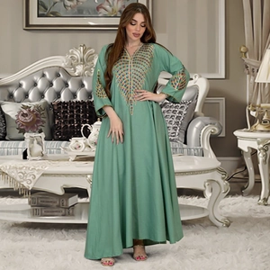 Elegant mint green Kaftan maxi dress with colorful geometric embroidery on sleeves