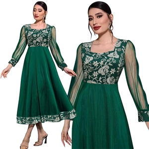 Dark green kaftan dress featuring white floral embroidery and sheer mesh sleeves