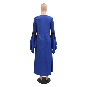 Macro shot of dark blue kaftan dress back with lace paneling and bell sleeves
