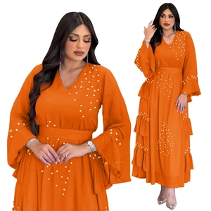 Detail of beaded pearls on orange chiffon dress with elegant V-neckline waist design