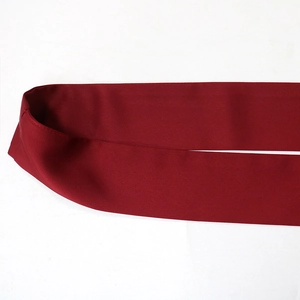 Close-up of wine red V-neck dress fabric texture with high-quality diagonal weave finish