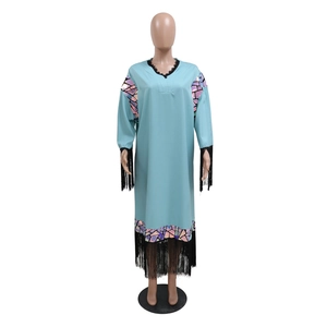 Detail of light blue sequin tassel dress with V-neck lace trim and geometric pattern