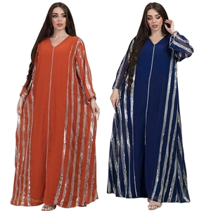 Close-up of loose-fit kaftan featuring vertical silver sequins on orange and navy chiffon