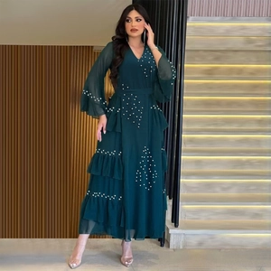 Elegant dark green chiffon long dress with white bead embellishments and ruffled hemline