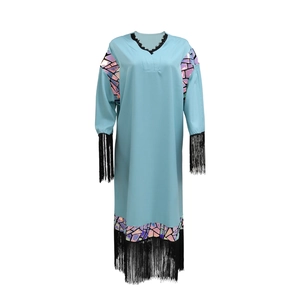 Close-up of light blue V-neck dress featuring holographic sequins and black fringe trim