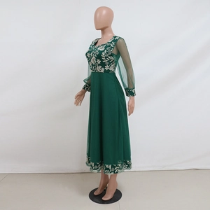 Detail of elegant dark green kaftan with intricate floral embroidery on mesh sleeves