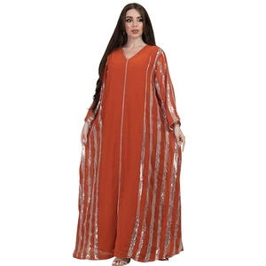 Detail of V-neck rust orange caftan featuring vertical silver sequin stripe patterns