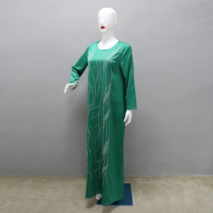 Detail of emerald green satin maxi dress with vertical silver sequin streamline patterns