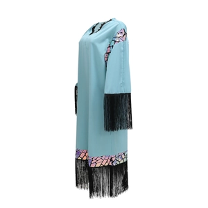 Detail of light blue sequin fringe robe with laser cut geometric patterns and lace