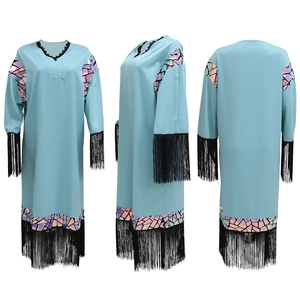 Three-way view showing black fringe tassels and colorful patterns on a light blue kaftan