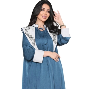 Peacock blue Jalabiya dress with white sequin embroidery and tied neckline detail