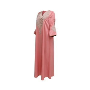 Close-up of the V-neck and colorful geometric embroidery on the pink kaftan maxi dress