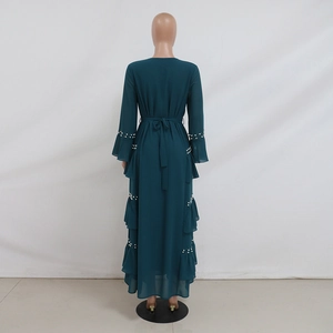 Detail of beaded pearls on the dark green chiffon maxi dress with tiered ruffles