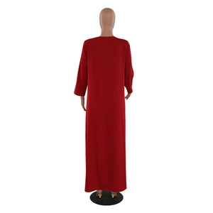 Back view of a red long-sleeved loose maxi dress with diamond embellishments