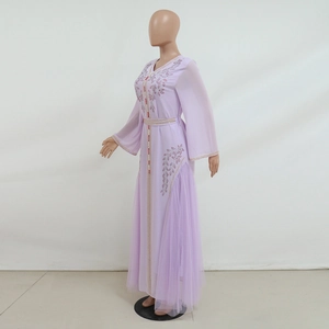 Detailed close-up of embroidery and diamond beadwork on a lavender mesh kaftan dress