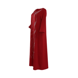 Detailed side view of deep red maxi dress with sparkling rhinestone feather patterns