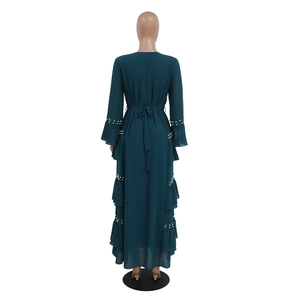 Detail view of dark teal chiffon maxi dress featuring elegant beaded ruffle layers