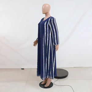 Detail of silver sequin vertical stripes on a navy blue long-sleeved chiffon dress